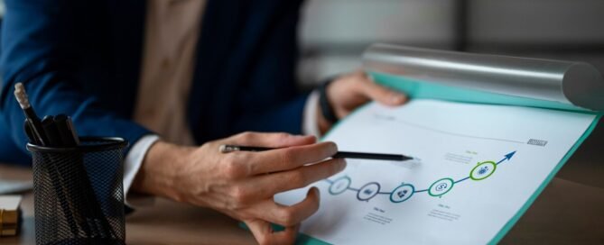 Person Office Analyzing Checking Finance Graphs 23 2150377128 (1)